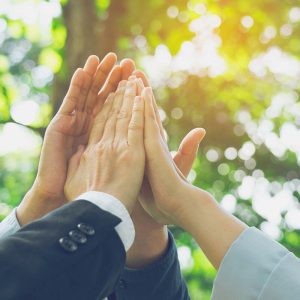 Business people doing a high five