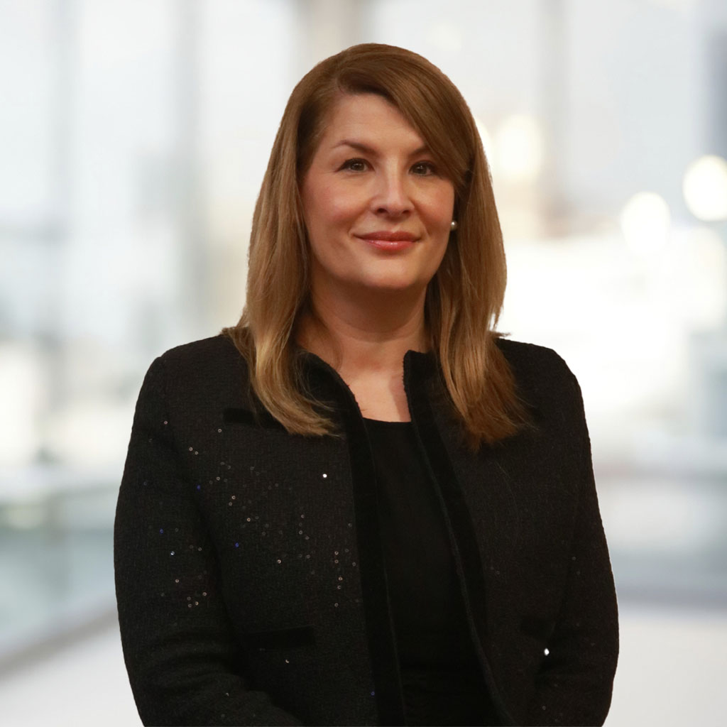 Sarah Hayward-Browne behind office background